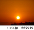 建設中のマンションと冬の宮崎の朝日と朝焼け　
