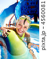 Child on water slide at aquapark. Child on water slide at aquapark.