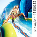 Child on water slide at aquapark. Child on water slide at aquapark.