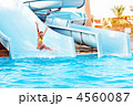 Child on water slide at aquapark. Child on water slide at aquapark.