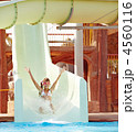 Child on water slide at aquapark. Child on water slide at aquapark.