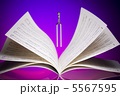 a tuning fork and music sheets a tuning fork and music sheets