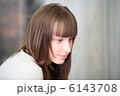 A Relaxed Young Woman Smiling With Hand On Chin