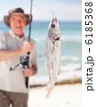 Man fishing at the beach Man fishing at the beach