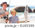 Man fishing with his grandson Man fishing with his grandson