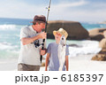 Man fishing with his grandson Man fishing with his grandson
