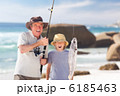 Man fishing with his grandson Man fishing with his grandson