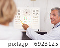 Doctor doing an eye test on a patient in a hospital