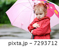 Adorable toddler girl at rainy day in autumn