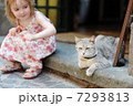 Adorable happy little girl and a cat