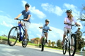 Caucasian Family Group Cycling Outdoors