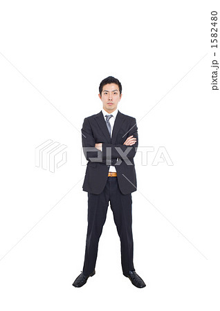 仁王立ちするビジネスマンの写真素材 仁王立ちするビジネスマンの写真素材