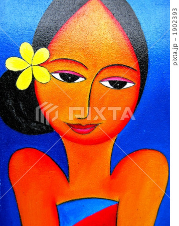 バリ島アート 黄色い花と女性 インドネシア の写真素材