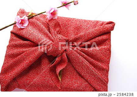 風呂敷包みと梅の花の写真素材