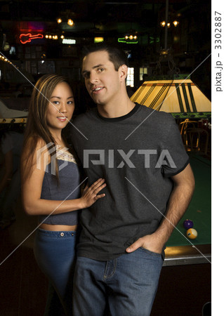 Couple by pool table. Couple by pool table. 3302887