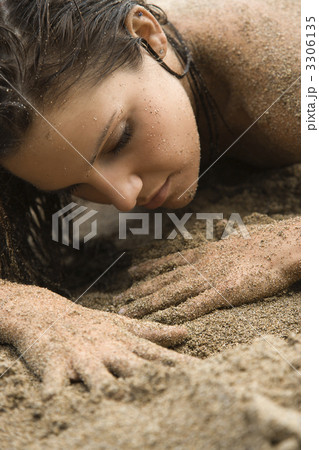 Woman in sand. Woman in sand. 3306135
