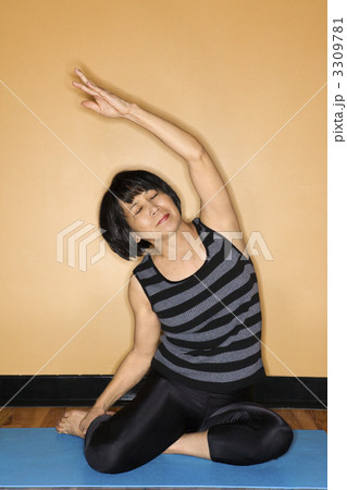 Woman Stretching in Yoga Pose Woman Stretching in Yoga Pose 3309781