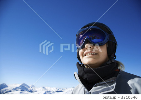 Boy snowboarder in mountains. 3310546