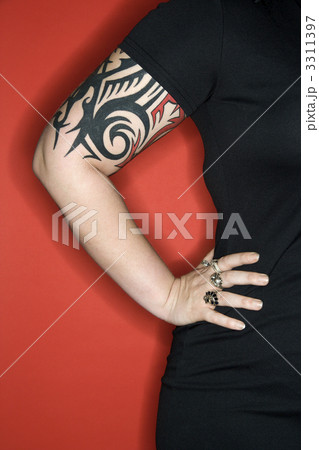 Tattooed woman arm. 3311397