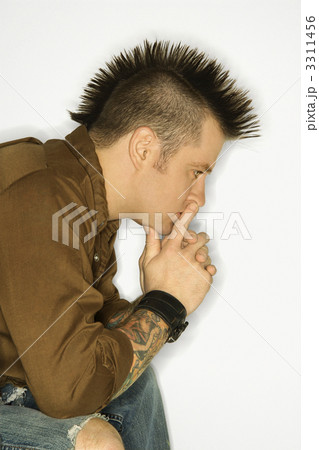 Man with tattoos and mohawk. Man with tattoos and mohawk. 3311456