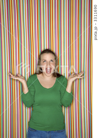 Woman shrugging with mouth open. 3311690
