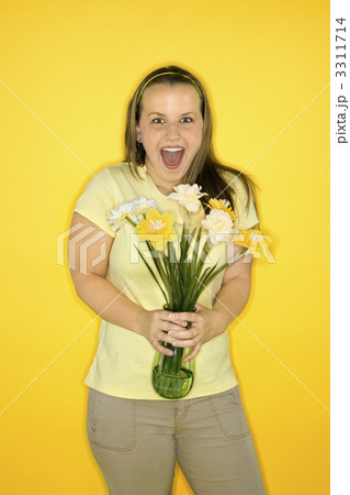 Happy woman holding flowers. Happy woman holding flowers. 3311714