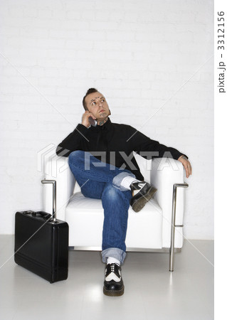 Man on cellphone with briefcase. 3312156