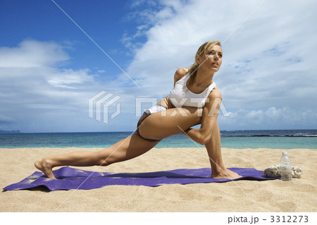 Attractive Young Woman Doing Yoga on Beach Attractive Young Woman Doing Yoga on Beach 3312273