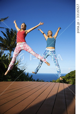 Women jumping into air. Women jumping into air. 3316927