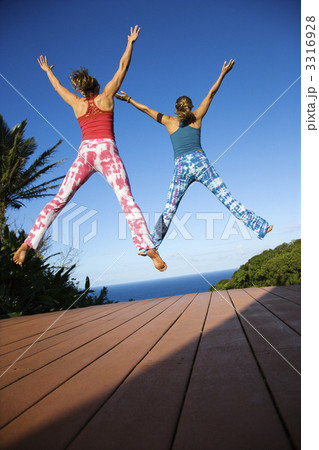 Women jumping into air. 3316928