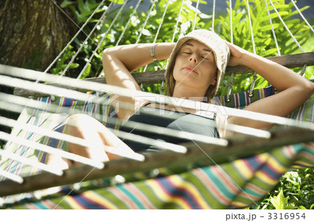 Woman relaxing in hammock. Woman relaxing in hammock. 3316954