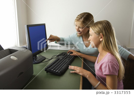 Mother and daughter on computer. 3317355