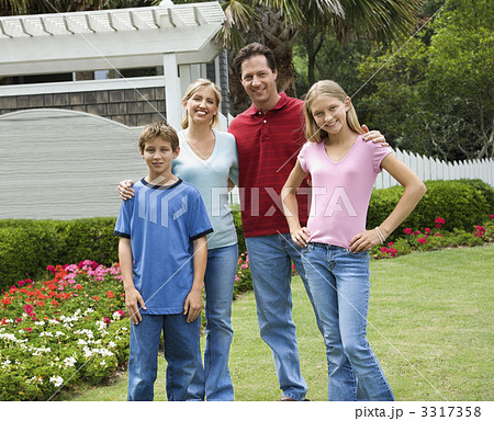 Portrait of family in yard. 3317358