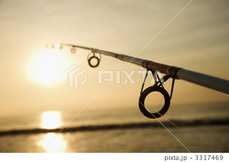 Fishing pole at sunset. 3317469