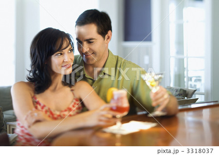 Couple at Bar Smiling and Drinking Couple at Bar Smiling and Drinking 3318037