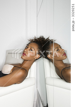 Attractive Young Woman Reclining in Chair Attractive Young Woman Reclining in Chair 3320251