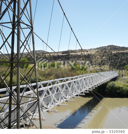 Suspension bridge over river. 3320560