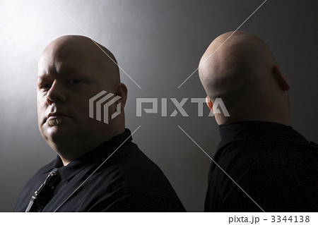 Twin men back to back. 3344138