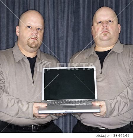 Twins with laptop. 3344145