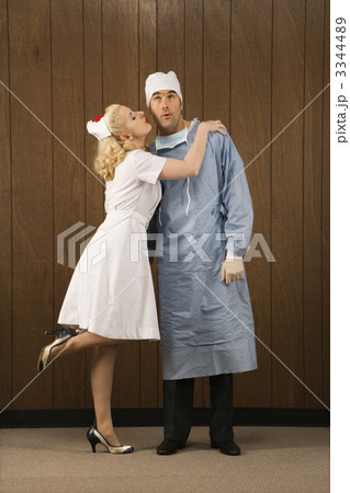 Nurse kissing doctor. 3344489