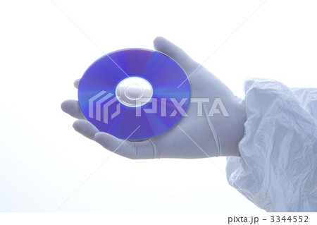 Gloved hand holding disc. Gloved hand holding disc. 3344552