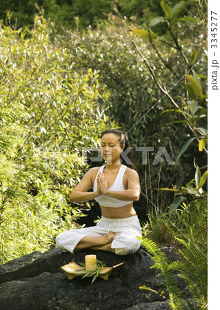 Asian woman meditating. 3345277