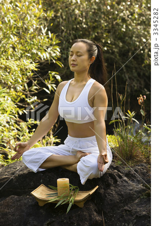 Asian woman meditating. 3345282