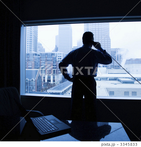 Businessman on phone in office. 3345833