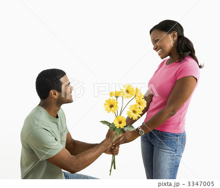 Man giving woman flowers. Man giving woman flowers. 3347005