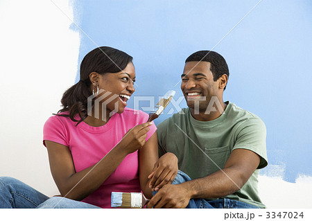 Couple playing with paint brushes. Couple playing with paint brushes. 3347024