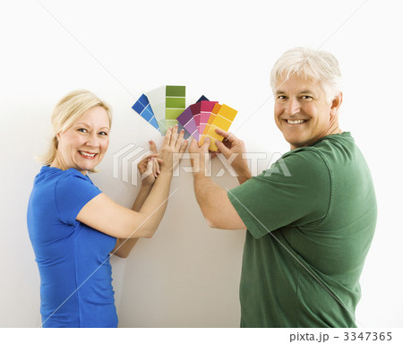 Man and woman comparing swatches. Man and woman comparing swatches. 3347365