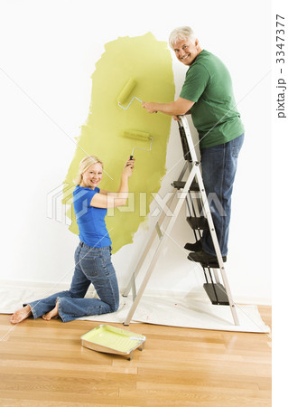 Couple painting wall. 3347377