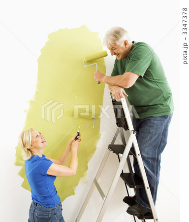 Couple painting wall. 3347378