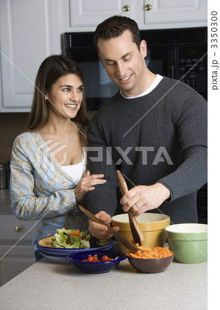 Couple in kitchen. 3350300